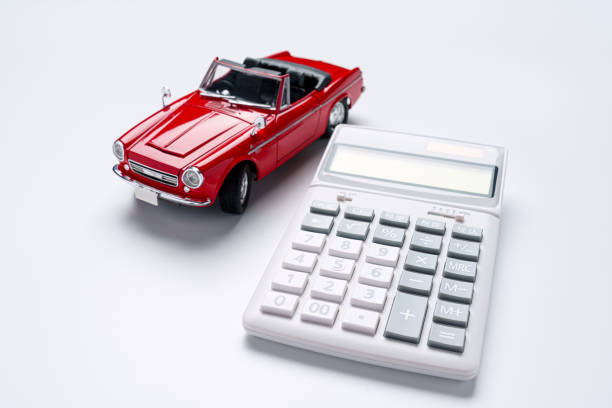 Calculator and sports car isolated on white background